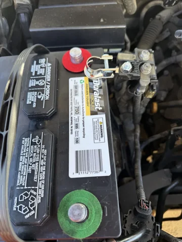 Under-hood battery and connected terminals.