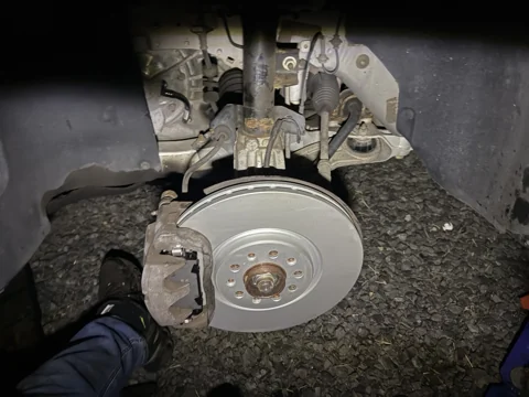 Brake rotor and caliper with the wheel removed.